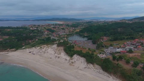 Aerial view of sandy beach dunes and lagoon near Sanxenxo in Galicia Spain Stock Footage 342694607