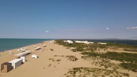 Aerial view of sandy beach with emerald sea and vacationers in Anapa, Russia Video stock 312862071