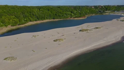 Aerial view of sandy beach, lake on the sea coast and forest on the Baltic sea Stock Footage 155809234