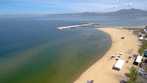 Aerial view of  sandy beach with pier for boats, Perea Thessaloniki Greece Stock-Footage 112687653
