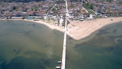 Aerial view of sandy beach with pier for  boats, Perea Thessaloniki Greece Stock Footage 112690280