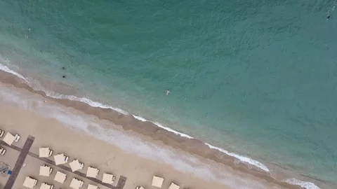 Aerial view of a sandy beach resort on the Mediterranean coast Stock Footage 337042187