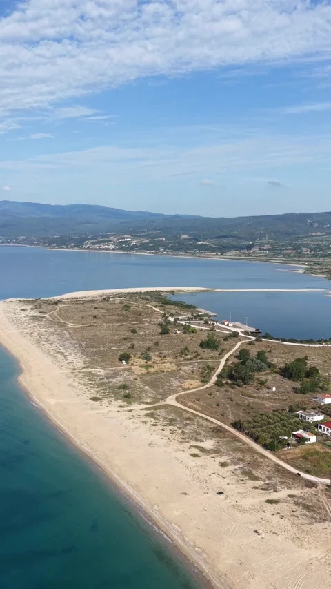 Aerial View of Sandy Beach Spit, Aegean Sea and Coastal Lagoon in Greece Video stock 342922677