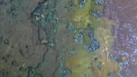 Aerial view of a sandy beach, starting from sea bed and revealing sunset Video stock 248468633