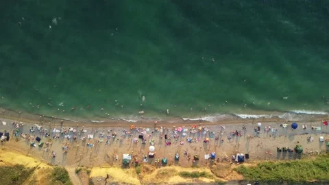 Aerial view of sandy beach, swimming peo... | Stock Video | Pond5