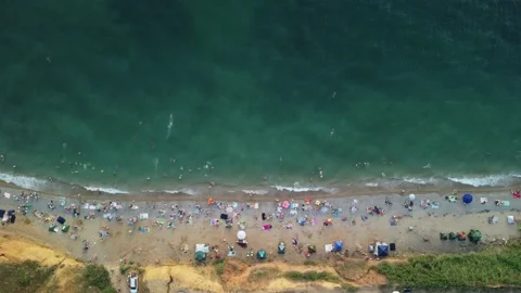 Aerial view of sandy beach, swimming peo... | Stock Video | Pond5