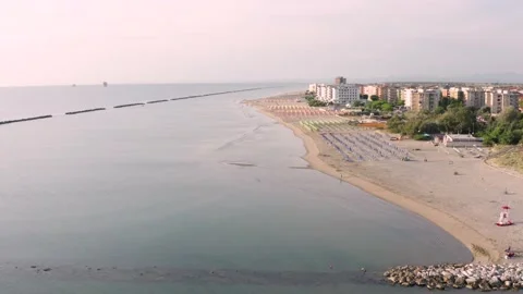 Aerial view of sandy beach with umbrellas and gazebos.Summer vacation Stock Footage 166074028