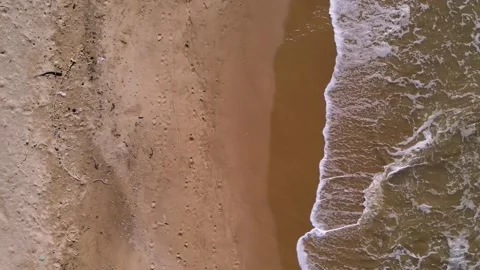 Aerial View of Sandy Beach with Wave Patterns Stock Footage 330668459