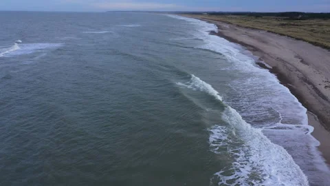 Aerial View of a Sandy Coastline. Waves Are Crashing to the Shore Stock Footage 201323912