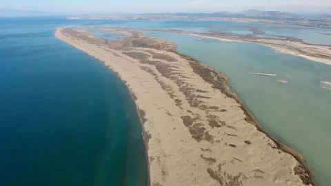 Aerial view of sandy longshore drift sands - Coastal Barrier and Ocean Landform Stock Footage 339375635