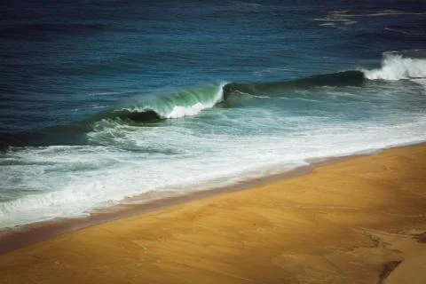 Aerial view of sandy North beach and Atlantc Ocean with big waves in Nazare Stock Photos