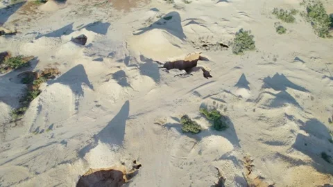 Aerial View of Sandy Opal Mining Test Pits Scattered Across Coober Pedy Stock Footage 345554151