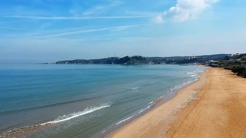 Aerial view of sandy sea beach in sunny day Stock Footage 101734783