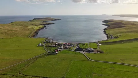 Aerial View of Sanick Beach and Village, Sandwick, Shetland Stock Footage 345472330