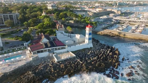 Aerial view of Santa Marta lighthouse and Cascais marina with Cascais cityscape Stock Footage 332024353