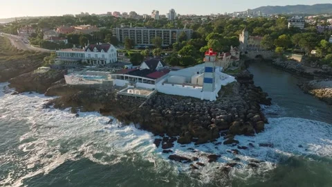 Aerial view of Santa Marta lighthouse and Cascais marina with Cascais cityscape Stock-Footage 344347722