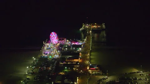 Aerial view of Santa Monica pier on a clear night in Los Angeles, California. Sh Stock Footage 199457053