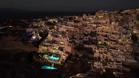 Aerial View of Santorini Island at NIght, White Buildings and Swimming Stock Footage 236339346