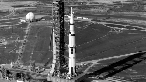 Aerial view of Saturn V rocket being moved on the crawler-transporter. Stock Footage 327796061
