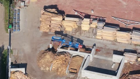 Aerial view of sawmill processing logs into lumber and wood chips Stock Footage 348631939