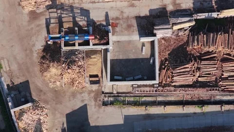 Aerial view of sawmill processing logs into wood chips and lumber with machinery Stock Footage 348632142