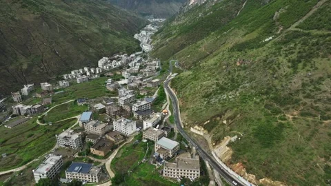 Aerial view of scattered rural settlements along winding river valley in Stockbeeldmateriaal 336664707