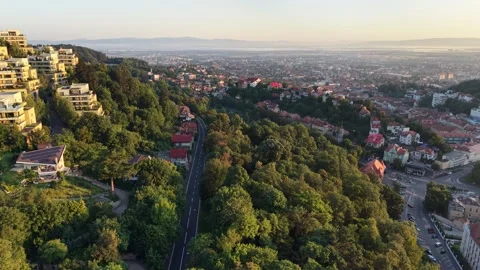 Aerial View of Scenic European Hillside Town with Modern Houses and Green Forest Stock Footage 344906341