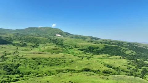 Aerial view of a scenic mountain range with solar farms Stock Footage 341731212