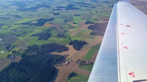 Aerial View of Scenic Patchwork Farmland from Airplane Window Stock Footage 312888646