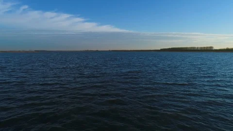 Aerial view of scenic sunset reflection over the water, Netherlands. Stock Footage 101567276