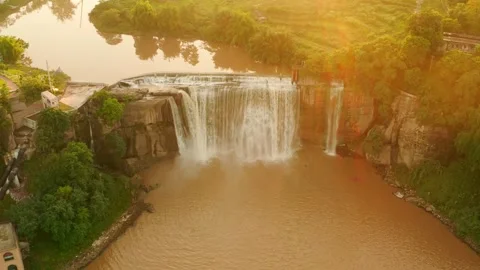 Aerial view of a scenic waterfall dam at sunset Stock Footage 341908262