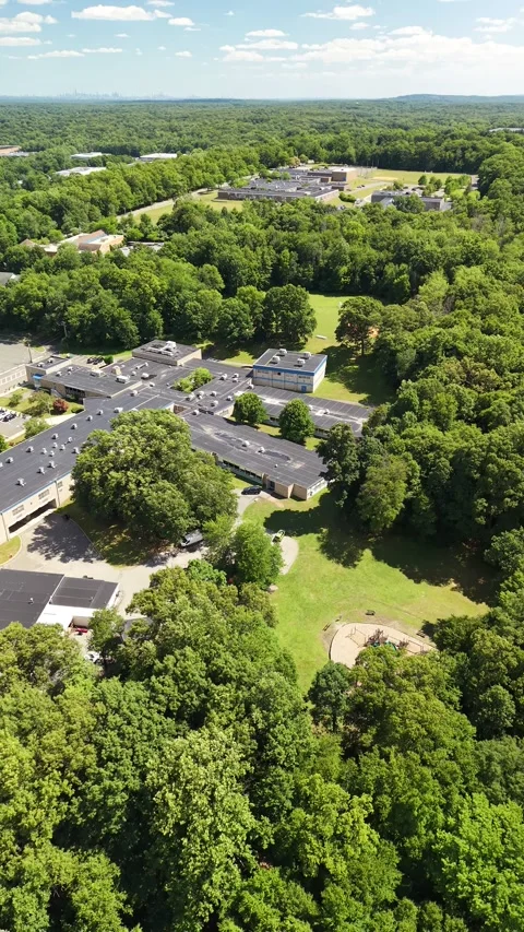 Aerial view of school building and playground in summer Stock Footage 340044575