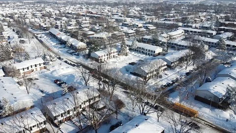 Aerial View of School Bus During Winter Afternoon in Montreal, Canada Stock Footage 125338565