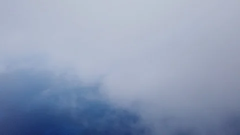 Aerial view of sea, clouds and land from a helicopter cabin flying over sea Video stock 111184162