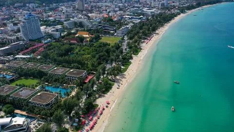 Aerial view of sea front hotels and apartments and tourists enjoying the be.. Stock Photos