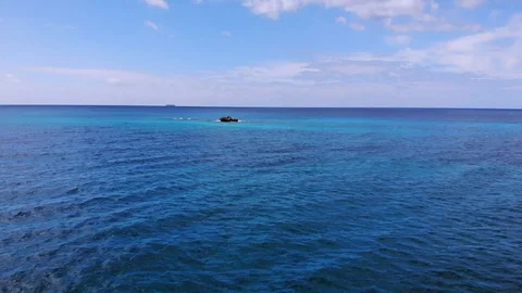 Aerial View of Sea Rocks in Clear Blue Waters, Grand Bahama, Bahamas Stock Footage 105535637
