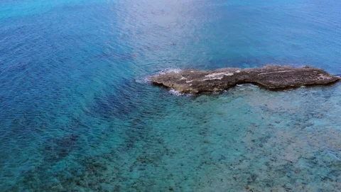 Aerial View of Sea Rocks in Clear Blue Waters, Grand Bahama, Bahamas Stock Footage 105535702