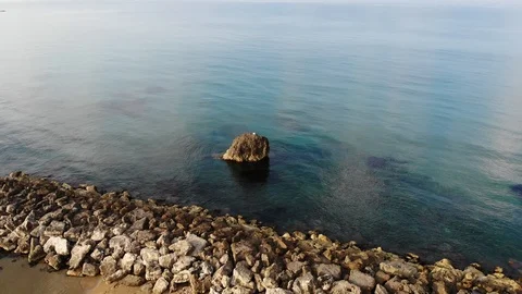 Aerial view of a sea stack in Cirica Bay, Sicily, Italy 4K Stock Footage 112860867