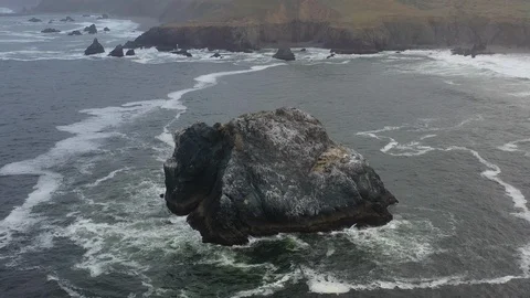 Aerial View of a Sea Stack Off the Coast of Northern California Stock Footage 111658385