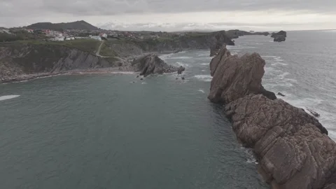Aerial view of sea stacks off a rugged rocky coastline Vídeos de archivo 342260831