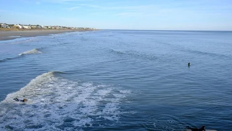 Aerial view of sea surface and surfers on it. Summer beach panoramic view Stock-Footage 102439482