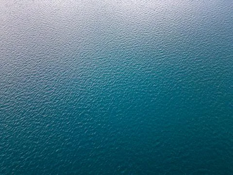 Aerial view of the sea surface pattern reflecting the sky background 스톡 사진