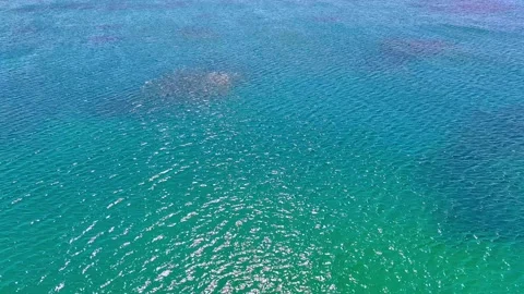 Aerial view of the sea surface with reflected sunlight. Video stock 335291162