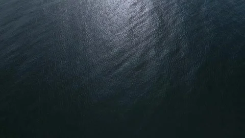 Aerial view of the sea surface reflecting the sun Stock Footage 255659420