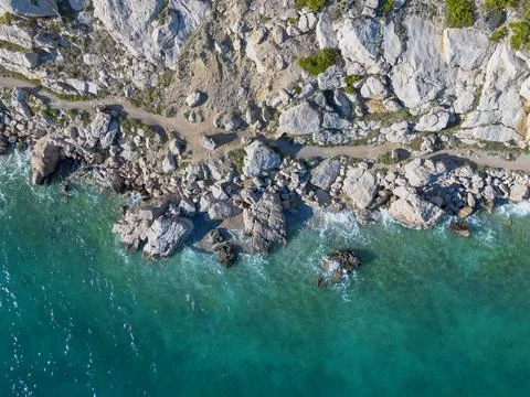 Aerial view of sea waves and rocks on the coast. Adriatic sea and coast of .. Stock Photos