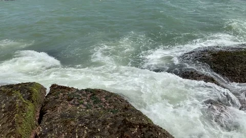 Aerial view of sea waves hitting rocks on the beach, sea waves and foam Stock Footage 164873280