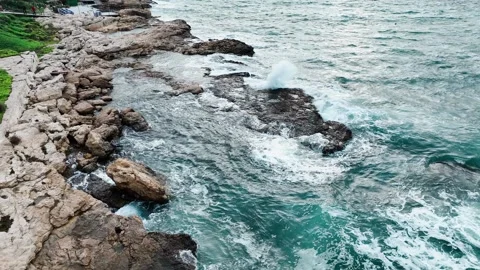 Aerial view of sea waves hitting the rocks with drone Stock Footage 255613000