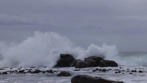 Aerial view of sea waves spraying on rocks in St. James, South Africa 스톡 동영상 221304551