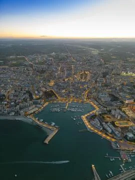 Aerial view of seafront and old town Bisceglie in Puglia with drone on sunset. Stock Photos