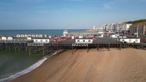 Aerial view of the seafront, beach and pier at Hastings Stock Footage 242914070